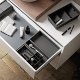 Accessory tray for bathroom cabinet